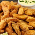 Filé de Tilápia em iscas de peixe fritas